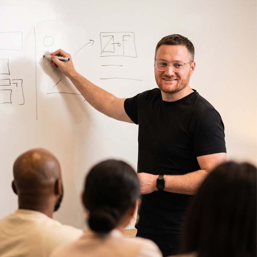 Ben Evans mapping a growth system on a whiteboard